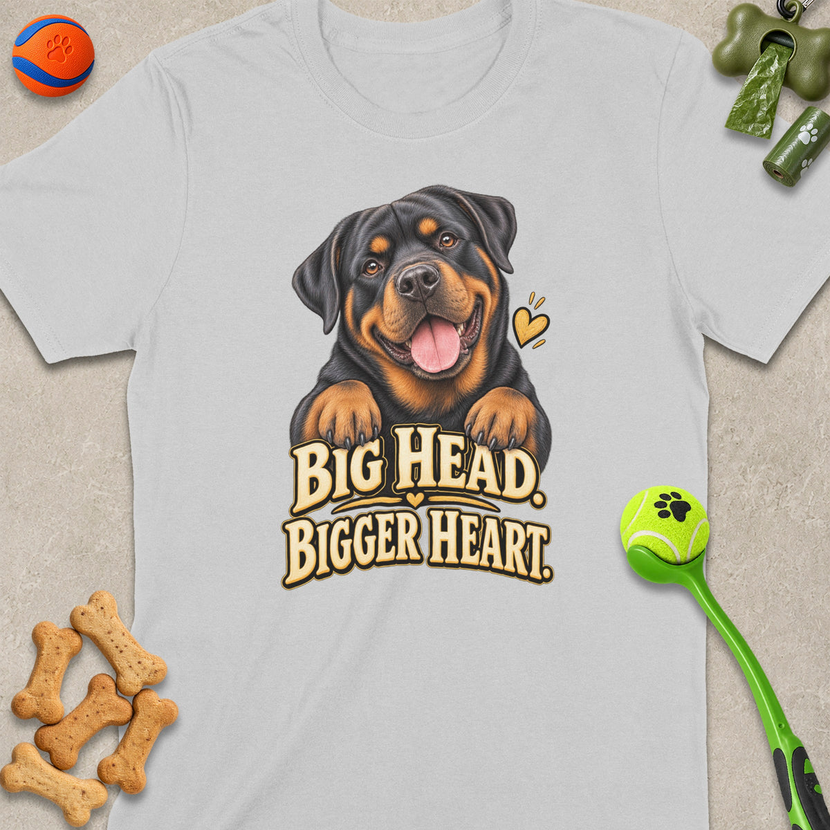 Rottweiler graphic with text "BIG HEAD. BIGGER HEART." on a gray t-shirt.