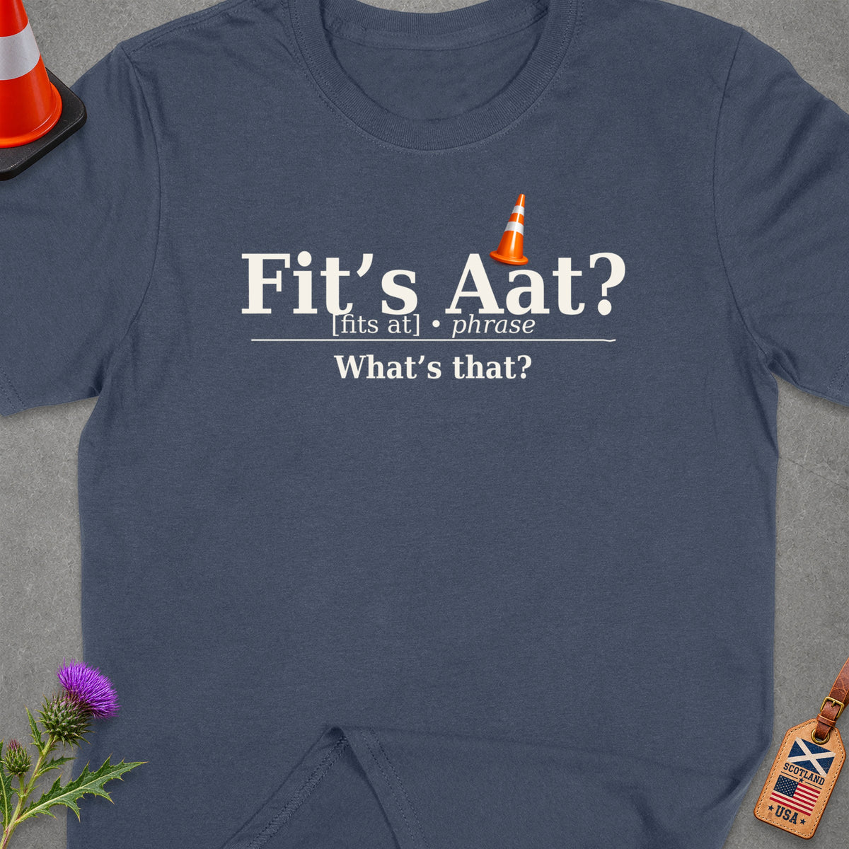 Dark blue t-shirt with "Fit's Aat? What's that?" text and traffic cone graphics.