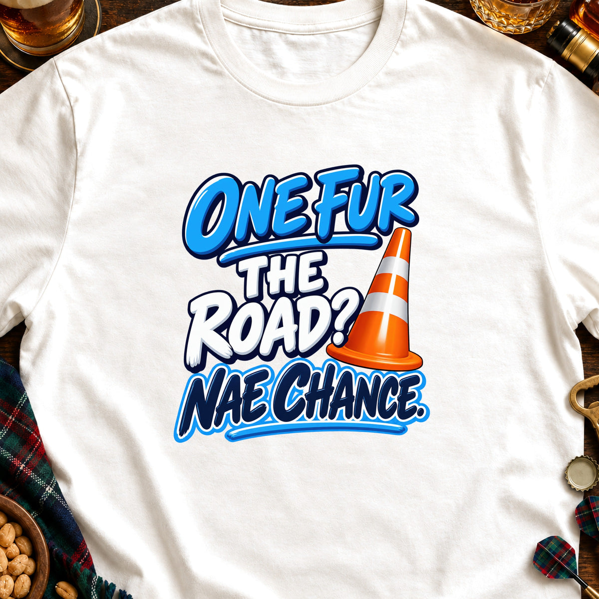 White t-shirt with text "ONE FUR THE ROAD? NAE CHANCE" and a traffic cone.