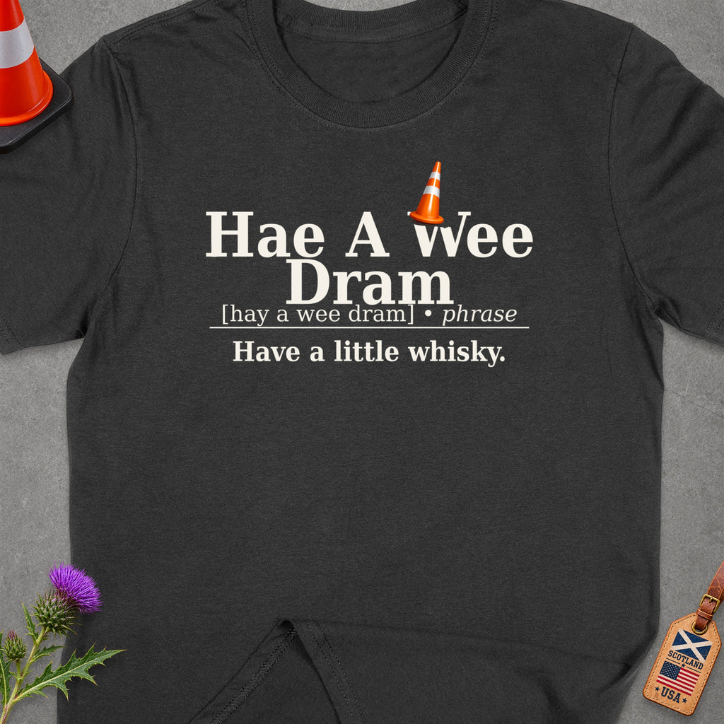 Dark grey t-shirt with "Hae A wee Dram" and its definition.