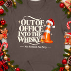 T-shirt with "Out of Office Into the Whisky" text and festive decor.