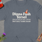 T-shirt with text "Dinna Fash Yersel" and its definition, with a traffic cone.