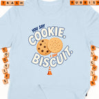 Light blue t-shirt with text "You say cookie, I say biscuit."