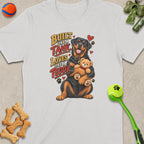 Rottweiler holding a teddy bear with text "Built Like a Tank Loves Like a Teddy".