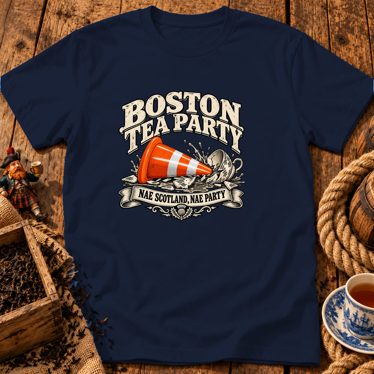 Navy t-shirt featuring graphic text Boston Tea Party with a traffic cone crashing into a teacup.