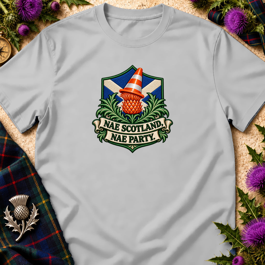 Light gray t-shirt featuring a crest with a Scottish flag, thistle, traffic cone, and text reading "NAE SCOTLAND, NAE PARTY."