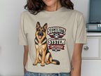 German Shepherd on t-shirt with "Security System Included" text.