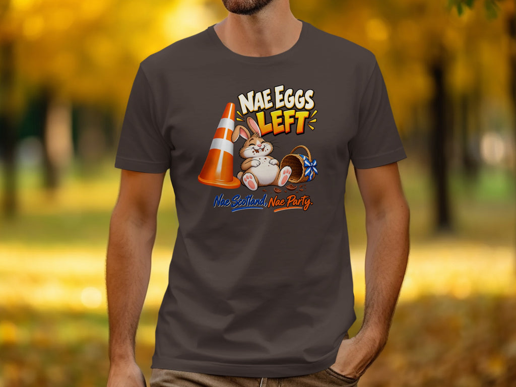 T-shirt with a cartoon bunny, traffic cone, and basket with text "Nae Eggs Left".