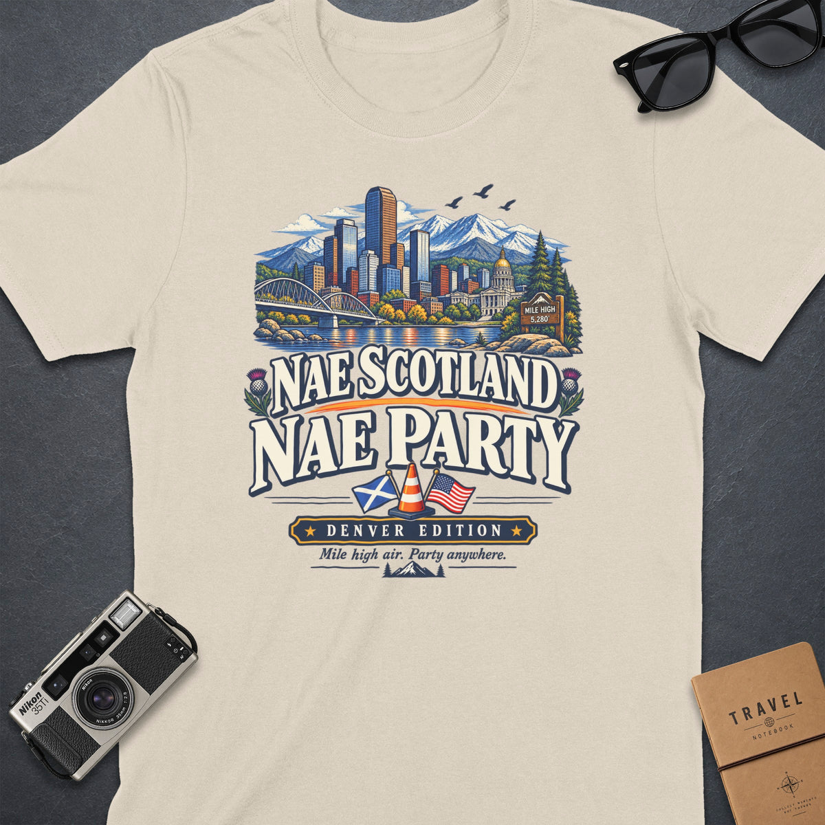 Cream t-shirt with "Nae Scotland Nae Party Denver Edition" graphic.
