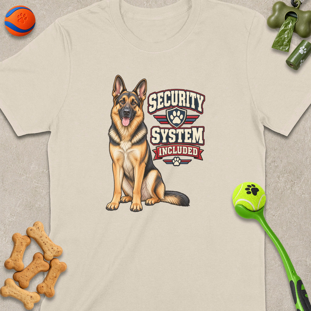 German Shepherd dog with "Security System Included" text graphic on a cream t-shirt.