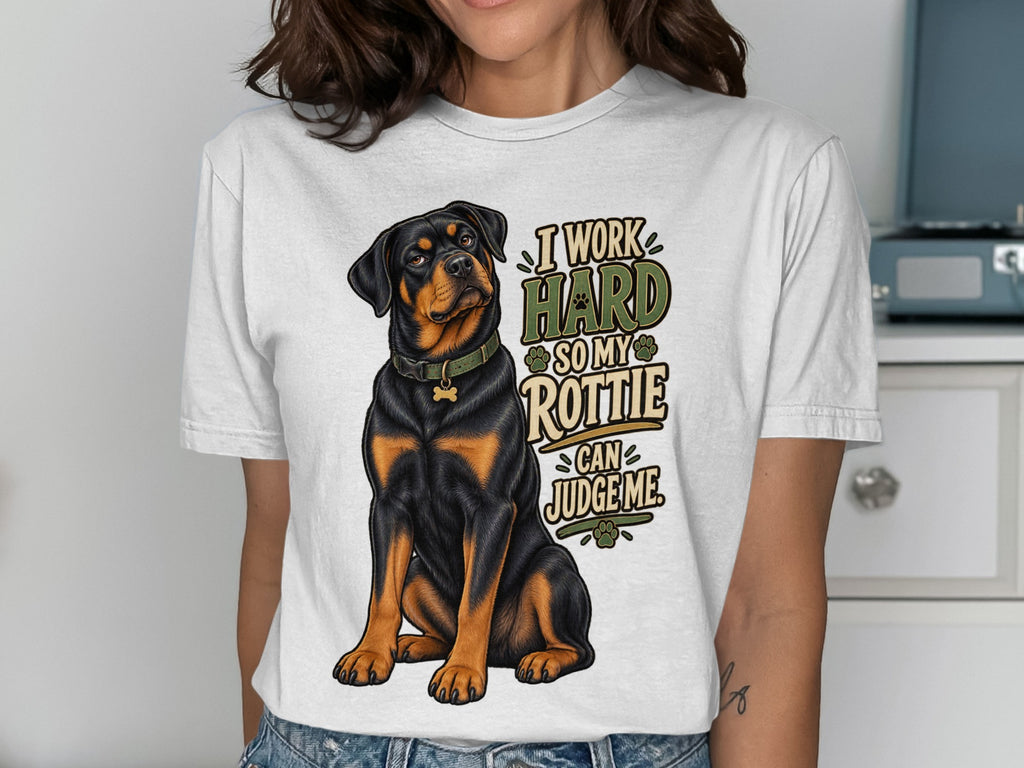 White t-shirt with Rottweiler illustration and text "I work hard so my Rottie can judge me."