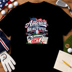 Black t-shirt featuring a golf graphic with American flag motifs and the text America the Beautiful, My Scorecard Isn't.