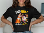 Two rabbits hold an Easter egg next to a traffic cone. "EGG HEIST Nae Scotland, Nae Party."