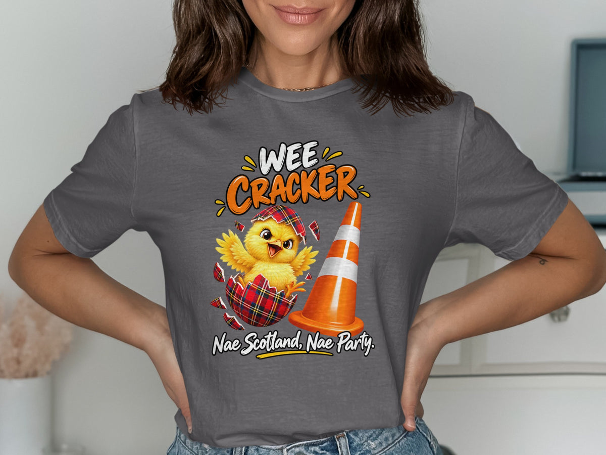 Chick hatching from a plaid egg beside a traffic cone with text "Wee Cracker".
