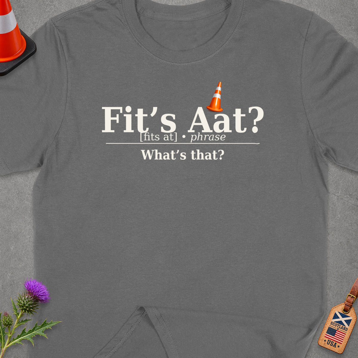 Grey t-shirt with "Fit's Aat? [fits at] phrase What's that?" text and traffic cone.