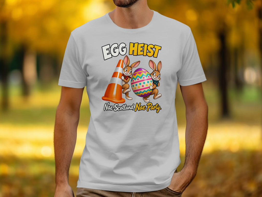 T-shirt with cartoon bunnies, traffic cone, and Easter egg with text "EGG HEIST" and "Nae Scotland, Nae Party".