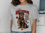 Rottweiler sitting and holding keys with text "My Rottweiler Runs This House."