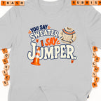 Grey t-shirt with "You say sweater, I say jumper" text and graphics.