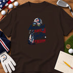 Brown t-shirt featuring a golf graphic with American flag motifs and the text American by Birth Golfer by Bad Decision.