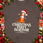 Christmas Party Survivor text on brown t-shirt with festive decorations.