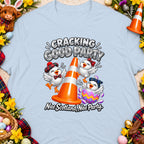 Three chicks celebrate around an orange traffic cone with text "Cracking Good Party" and "Nae Scotland, Nae Party."