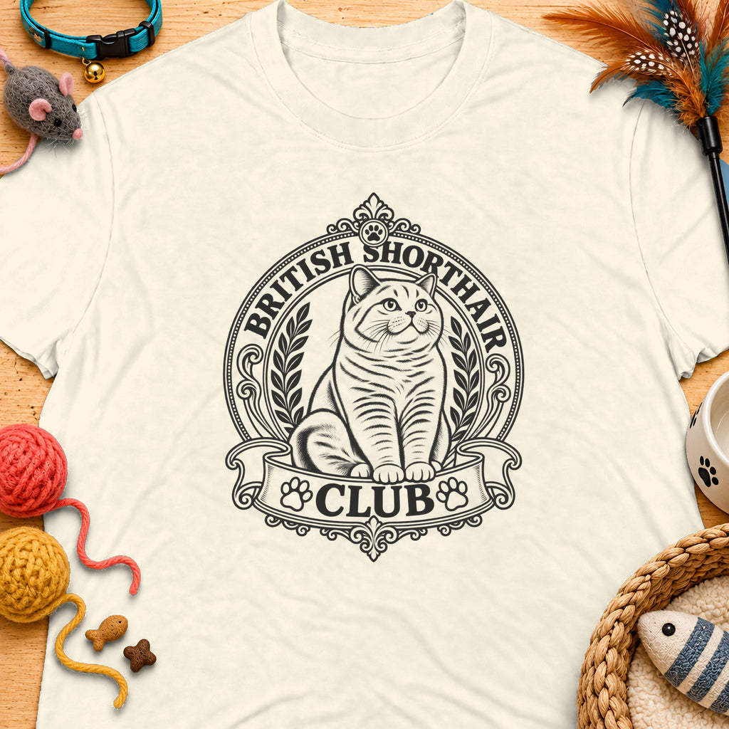 Cream t-shirt with British Shorthair Club logo featuring a cat and floral accents.