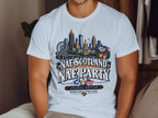 White t-shirt with Atlanta skyline, "Nae Scotland Nae Party" text, and Southern charm tagline.