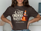 Brown t-shirt with "Last Orders, Santa" and a traffic cone.