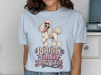 Poodle Hair Don't Care graphic t-shirt with a white poodle wearing sunglasses.