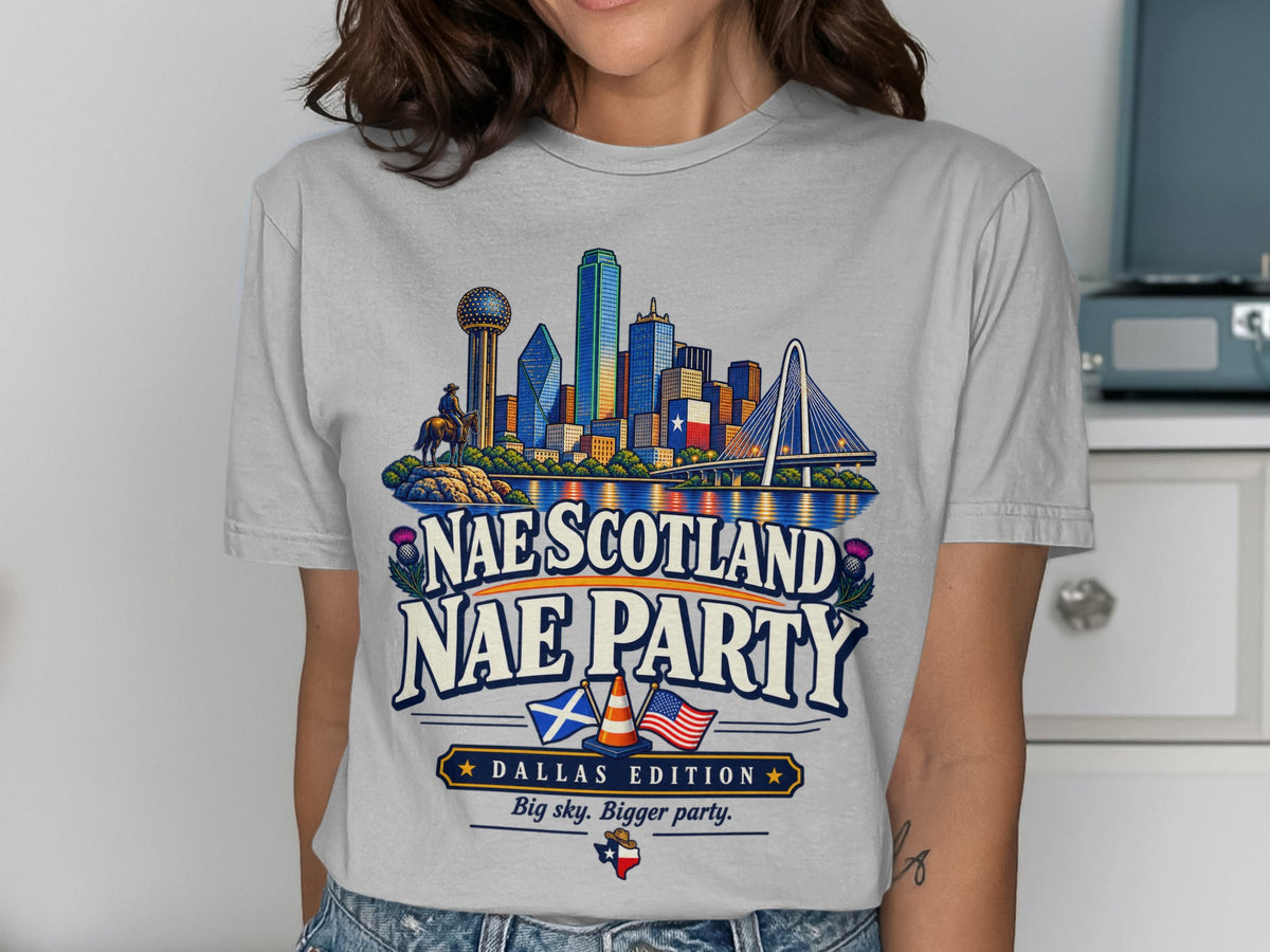 T-shirt graphic: Dallas skyline, cowboy on horse, Scottish thistle, "Nae Scotland Nae Party", "Dallas Edition".