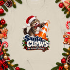 A cat in a Santa hat holds an orange traffic cone with "Santa Claws" text.