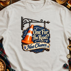 Graphic shirt with a hanging sign reading "One Fur The Road? Nae Chance."