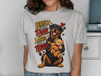 Rottweiler hugs teddy bear with text "Built like a tank, loves like a teddy".