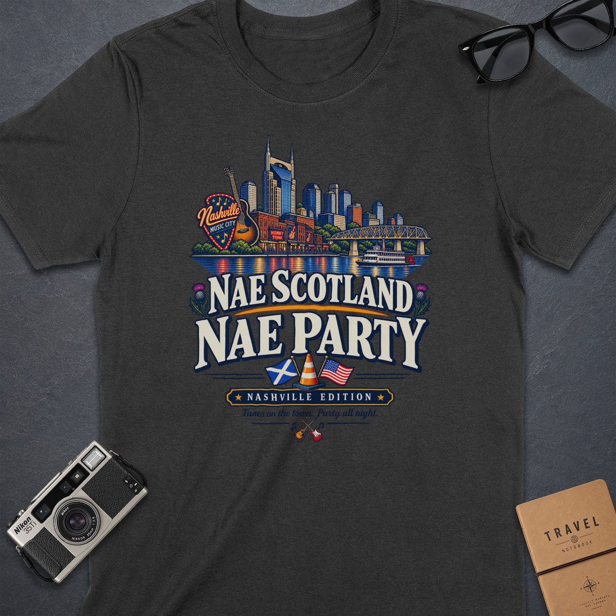 T-shirt with Nashville skyline graphic and text "Nae Scotland Nae Party".