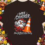 T-shirt with a chick hatching from a tartan egg, traffic cone, and text "Wee Cracker".