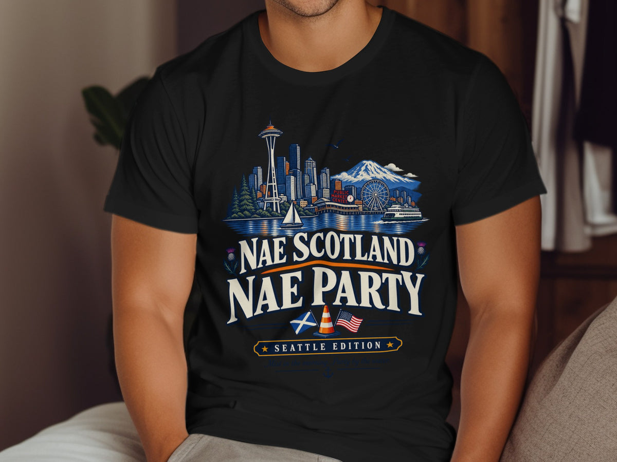 T-shirt with Seattle skyline, mountains, text "Nae Scotland Nae Party", and flags.