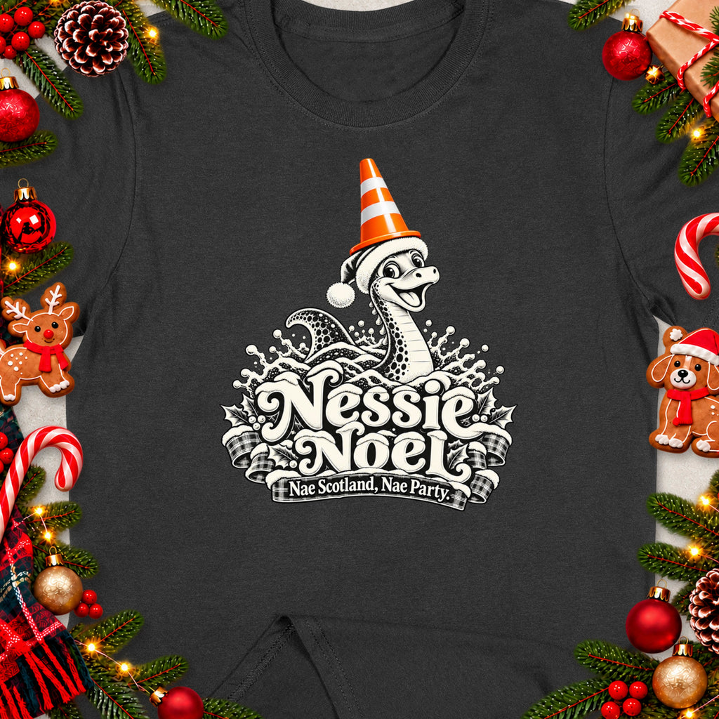 Dark t-shirt with Nessie wearing a Santa hat and traffic cone, "Nessie Noel" text.