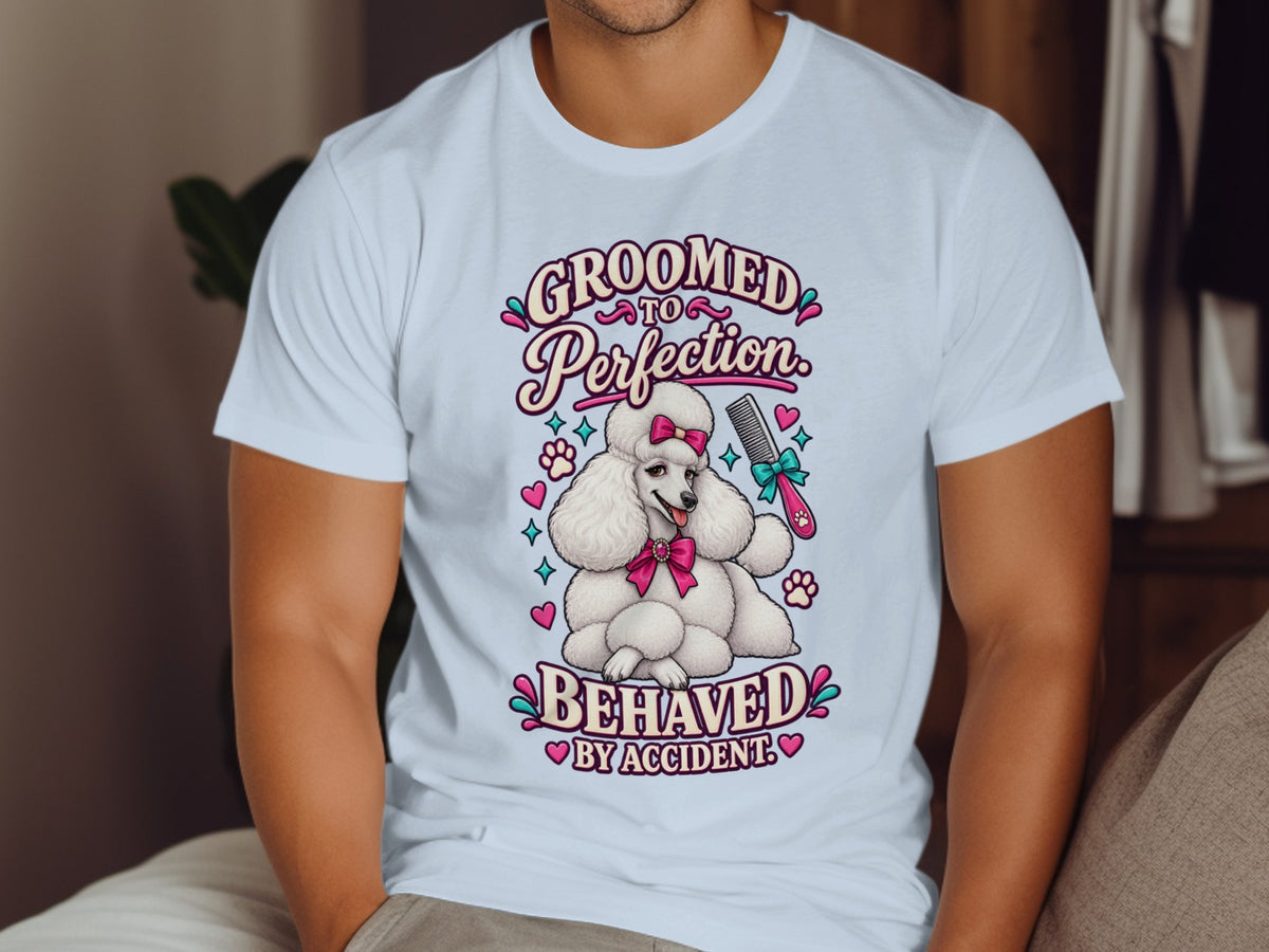 White t-shirt with poodle graphic and text: "Groomed to Perfection. Behaved by Accident."