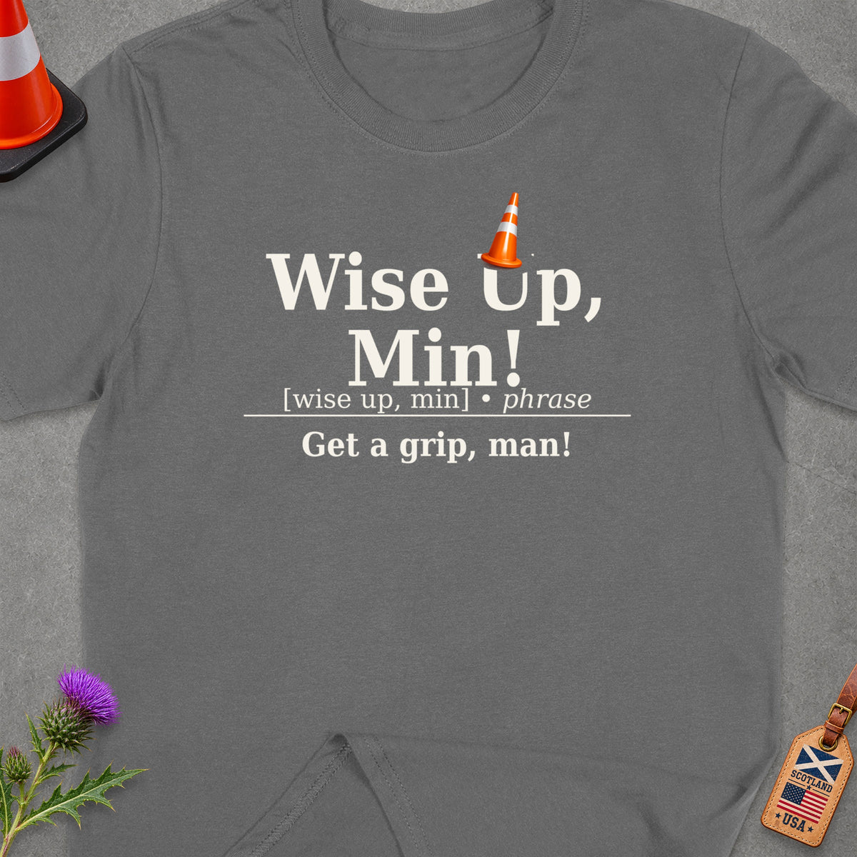 Grey t-shirt with "Wise Up, Min! Get a grip, man!" text and traffic cone graphic.