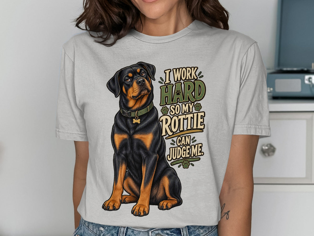 Light gray t-shirt with a Rottweiler and text "I work hard so my Rottie can judge me".