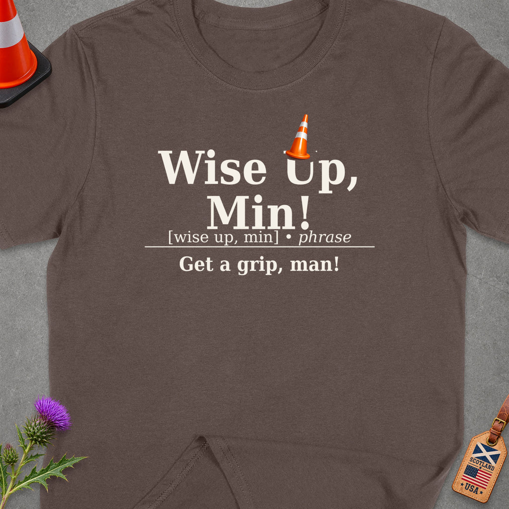 Brown t-shirt with text "Wise Up, Min! Get a grip, man!" and traffic cone graphic.