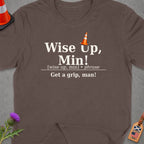 Brown t-shirt with text "Wise Up, Min! Get a grip, man!" and traffic cone graphic.