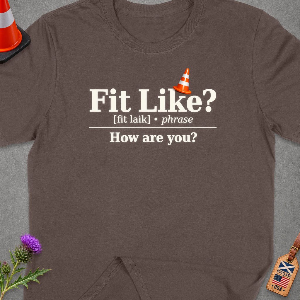 Brown t-shirt with "Fit Like? [fit laik] phrase How are you?" text.
