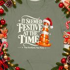 Traffic cone with Santa hat and lights, text "IT SEEMED FESTIVE AT THE TIME".