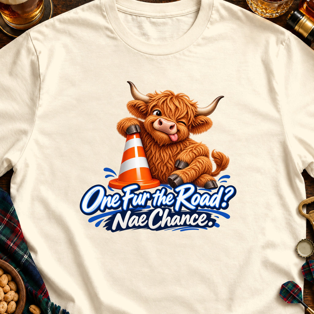 Fluffy Highland cow with a traffic cone and text "One Fur the Road? Nae Chance."
