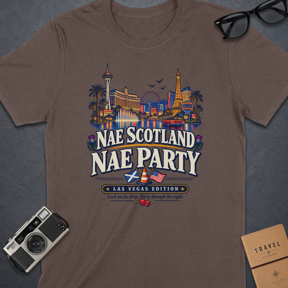 Brown t-shirt with "Nae Scotland Nae Party" and Las Vegas skyline graphic.