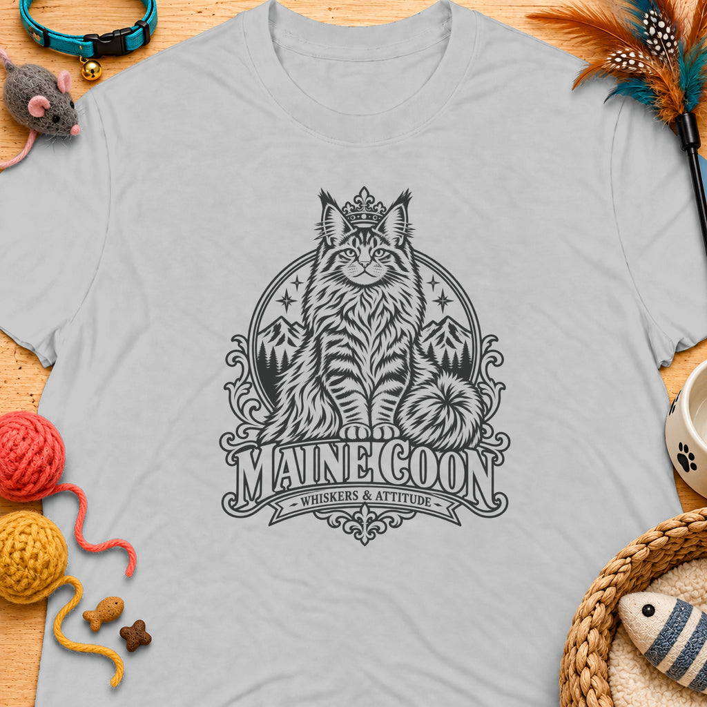 Grey t-shirt featuring a distressed graphic of a crowned Maine Coon cat, mountains, and text.