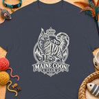Maine Coon Club logo with a crowned cat, mountains, and trees on a navy t-shirt.