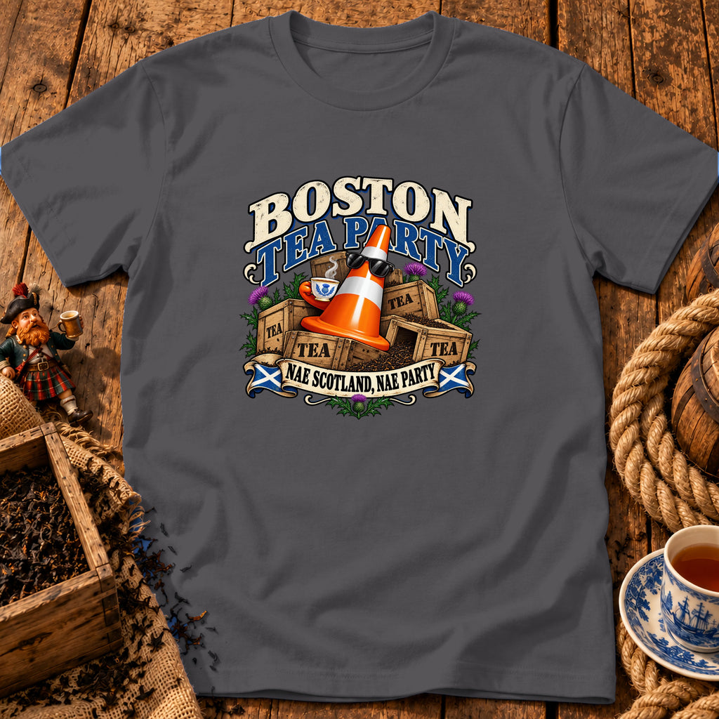 A dark gray t-shirt featuring a humorous graphic of a traffic cone drinking tea amidst crates labeled tea, with the text Boston Tea Party and Nae Scotland, Nae Party.