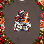 Scottish Terrier wearing Santa hat and scarf holds traffic cone with "Pawsitively Merry" text.